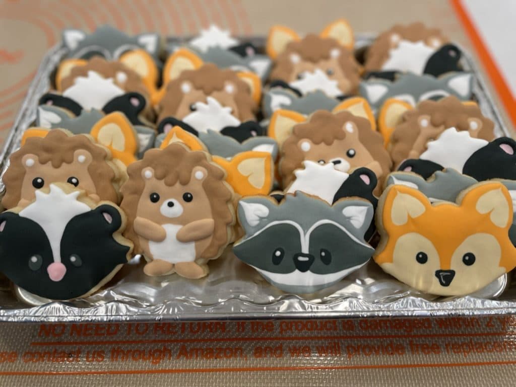 Woodland animal cookies with foxes, raccoons, skunks, and hedgehogs