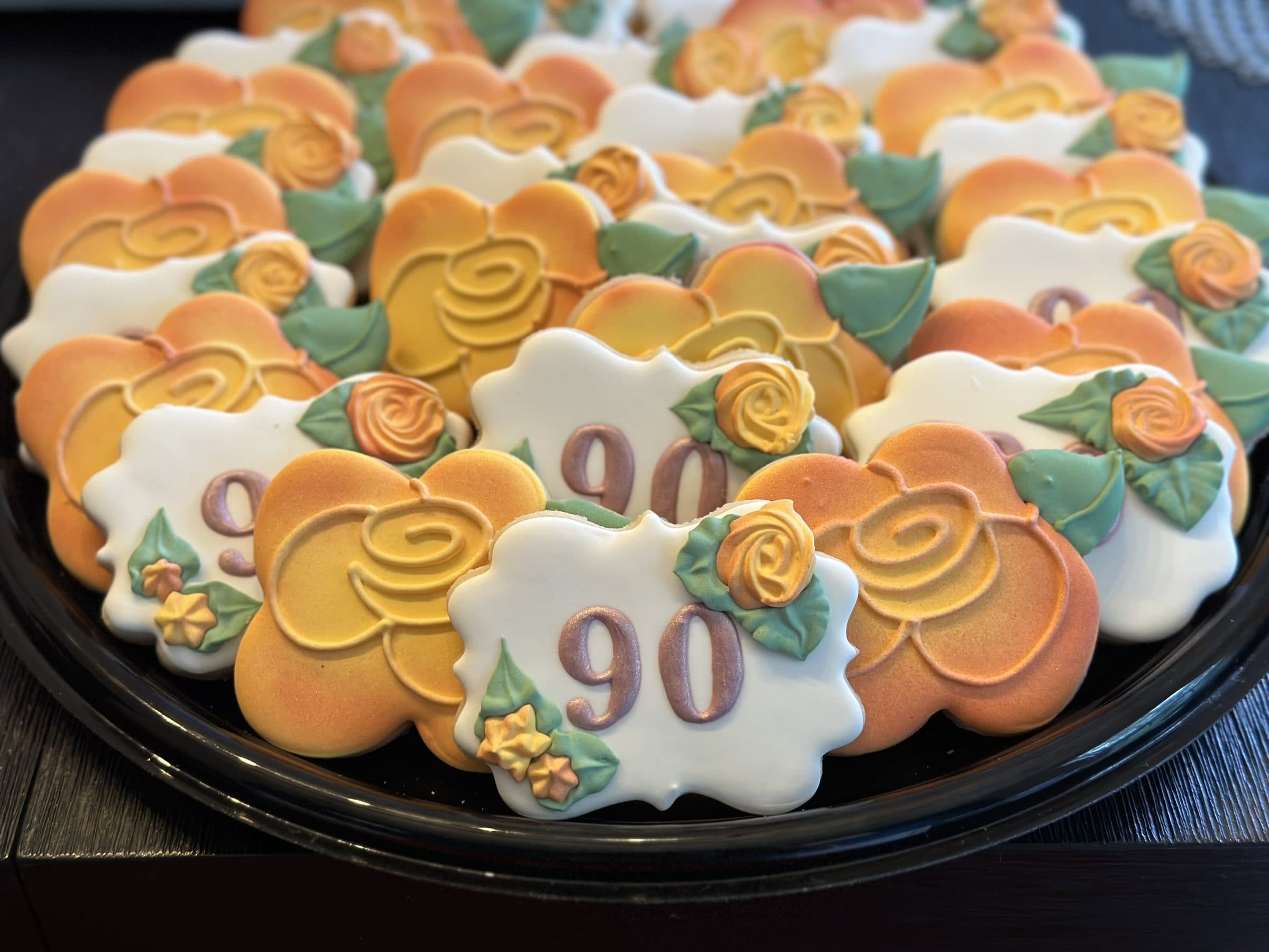Orange rose cookies celebrating a 90th birthday