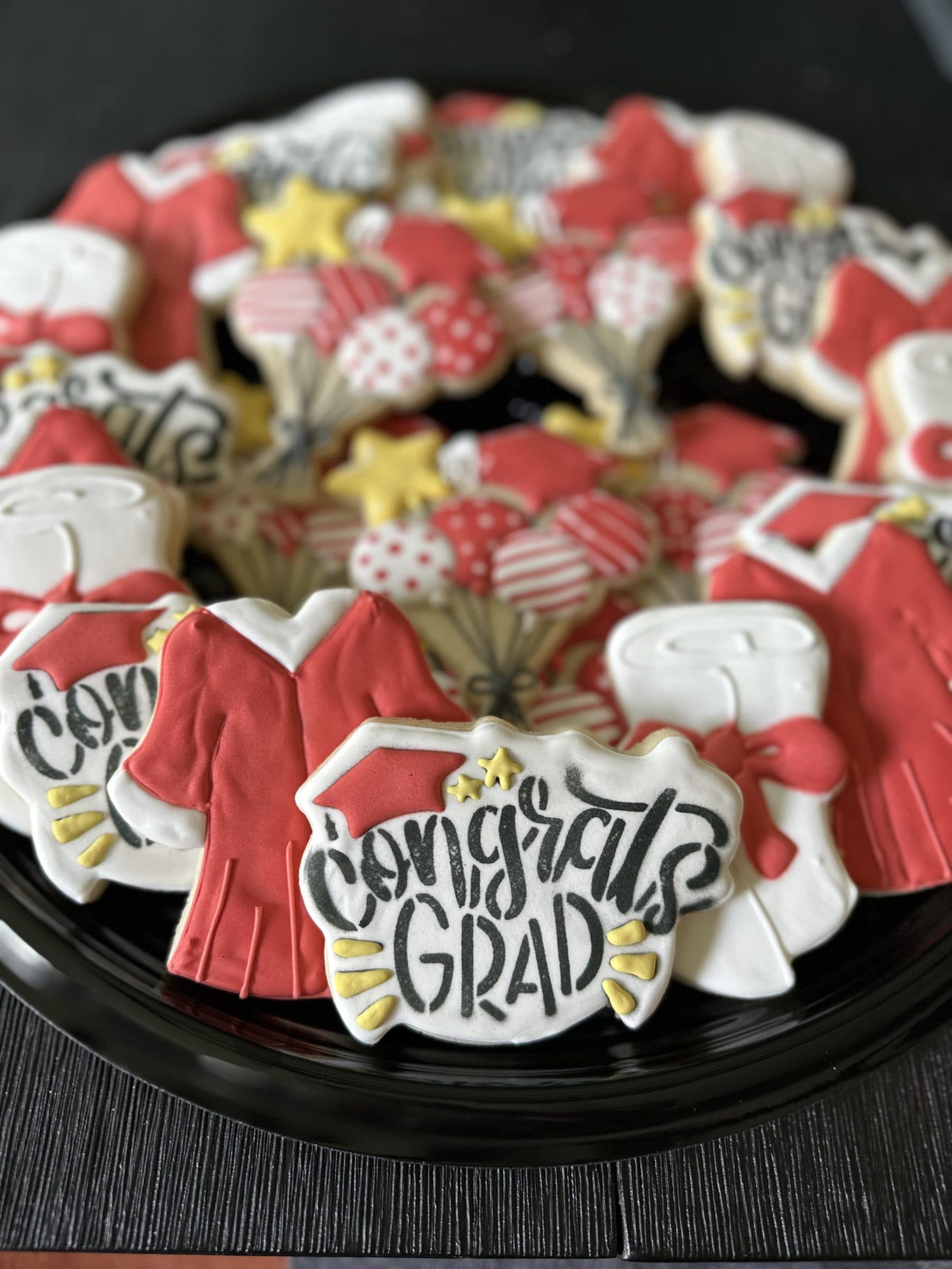 Red Congrats Grad cookies with caps and gowns