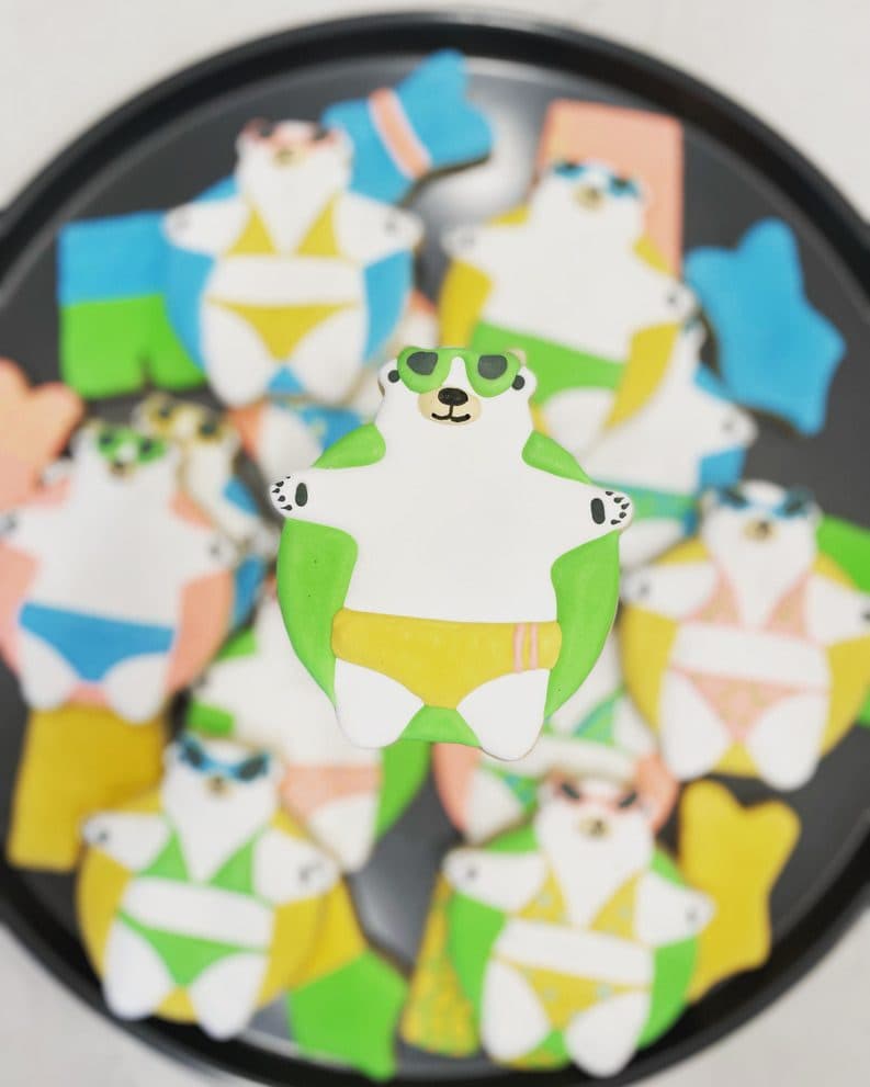 Colorful swim club frog and swimsuit cookies