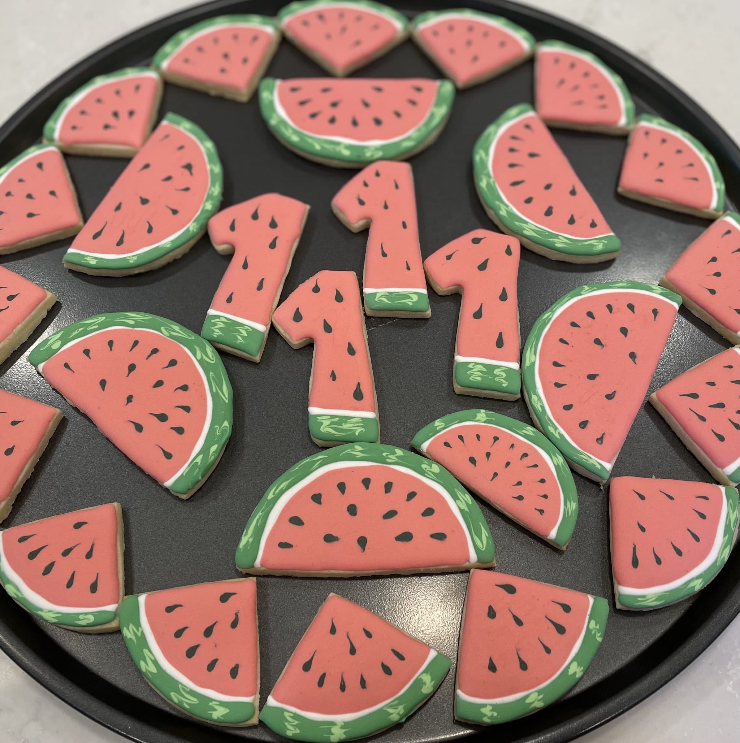 Watermelon slice and number one cookies for a first birthday